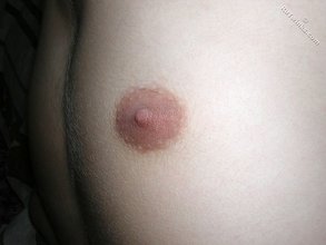 Young blonde twink shows off his cock and feet