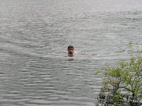 Brunette twink goes skinny dipping and masturbates