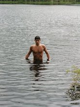 Brunette twink goes skinny dipping and masturbates