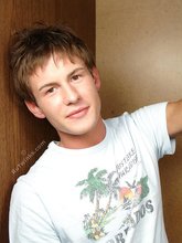 Brunette twink slowly taking off his t-shirt on camera