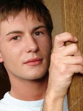 Brunette twink slowly taking off his t-shirt on camera