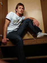 Brunette twink slowly taking off his t-shirt on camera