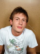 Brunette twink slowly taking off his t-shirt on camera