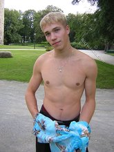 Big-dicked twink boy posing in Hawaiian shirts outdoors