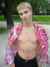 Big-dicked twink boy posing in Hawaiian shirts outdoors