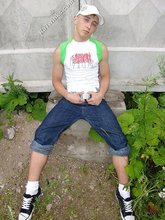 Jorts and baseball cap stylish twink posing half-naked