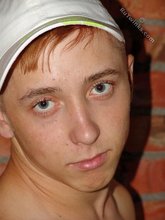 Jorts and baseball cap stylish twink posing half-naked