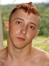 Jorts and baseball cap stylish twink posing half-naked
