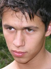 Big-dicked twink brunette posing in the forest naked