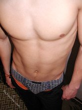 Brown-haired twink boy undressing and showing his hairy cock