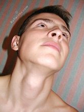 Brown-haired twink boy undressing and showing his hairy cock