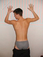 Brown-haired twink boy undressing and showing his hairy cock