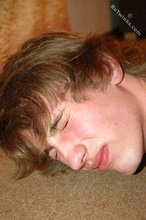 White shirt long-haired twink takes his captor's meaty cock