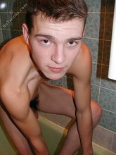 Hairy cock twink pours a glass of cum all over himself