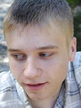 Young-looking blonde twink whips out his cock outdoors