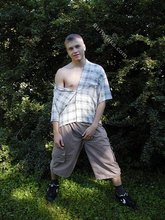 Young-looking blonde twink whips out his cock outdoors