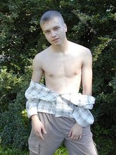 Young-looking blonde twink whips out his cock outdoors