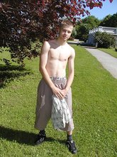 Young-looking blonde twink whips out his cock outdoors