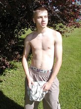 Young-looking blonde twink whips out his cock outdoors