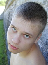 Blue-eyed and baby-faced twink undressing outdoors