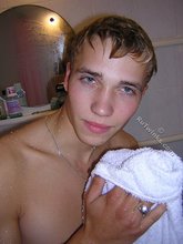 Blond-haired twink flipping off and taking a shower