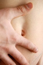 Seductive-looking twink boy shows off his cock and ass