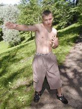 Baggy shorts baby-faced twink shows his cock up close