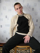 Black pants twink boy is posing indoors and outdoors