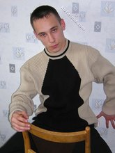 Black pants twink boy is posing indoors and outdoors