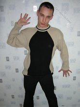Black pants twink boy is posing indoors and outdoors