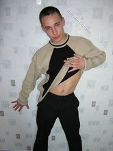 Black pants twink boy is posing indoors and outdoors