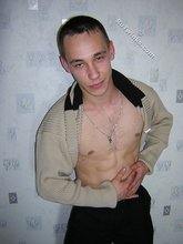 Black pants twink boy is posing indoors and outdoors