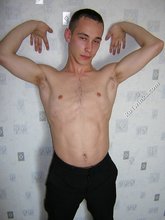 Black pants twink boy is posing indoors and outdoors