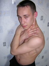 Black pants twink boy is posing indoors and outdoors