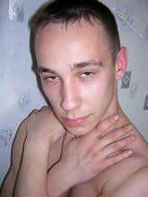 Black pants twink boy is posing indoors and outdoors