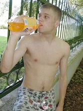 Blue-eyed twink boy posing completely naked outdoors