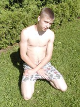 Pale and blond-haired twink gets his naked ass on the grass