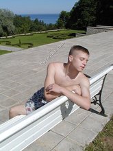 Pale and blond-haired twink gets his naked ass on the grass