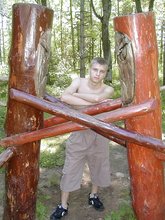 Horny twink with a hairy cock posing naked outdoors