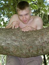 Horny twink with a hairy cock posing naked outdoors