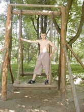 Horny twink with a hairy cock posing naked outdoors