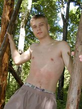Horny twink with a hairy cock posing naked outdoors