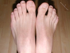 Brown-eyed twink boy shows his cock and his toes