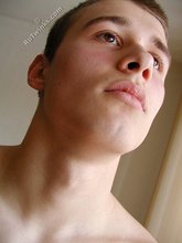Brown-eyed twink boy shows his cock and his toes
