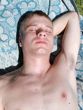 Pasty-looking twink jerking off his cock outdoors