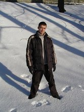 Pasty twink boy posing outdoors in his winter coat