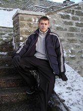 Pasty twink boy posing outdoors in his winter coat