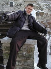 Pasty twink boy posing outdoors in his winter coat