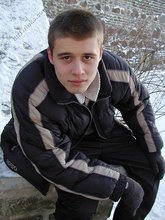 Pasty twink boy posing outdoors in his winter coat