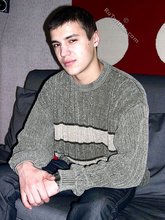 Sweater-wearing brunette boy undressing on camera